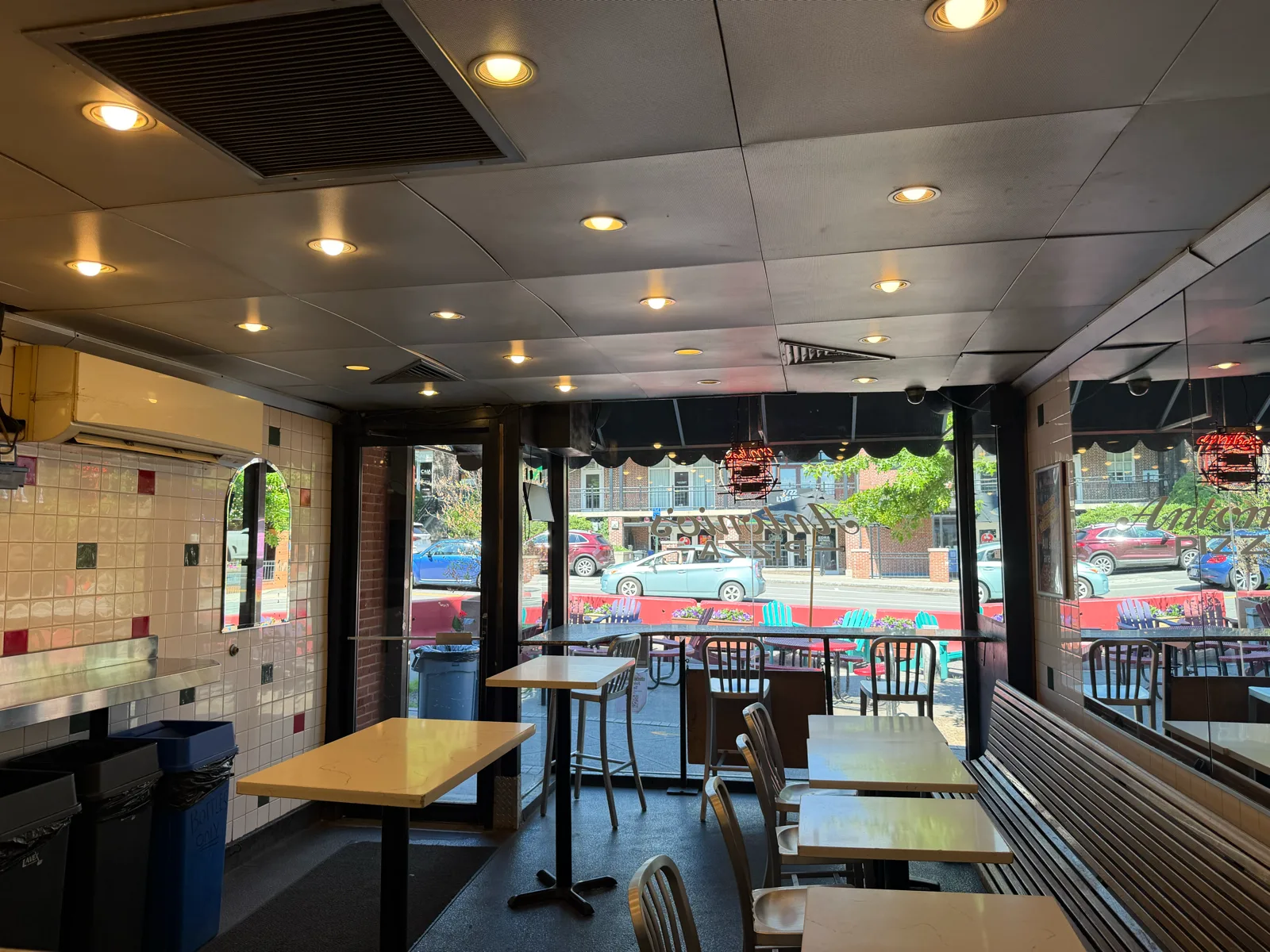 Indoor seating with a downtown Amherst street view at Antonio's Pizza