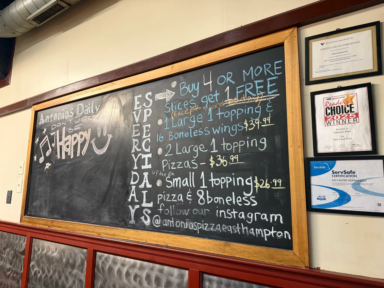 Antonio's Easthampton specials board beside its Reader's Choice 2025 award