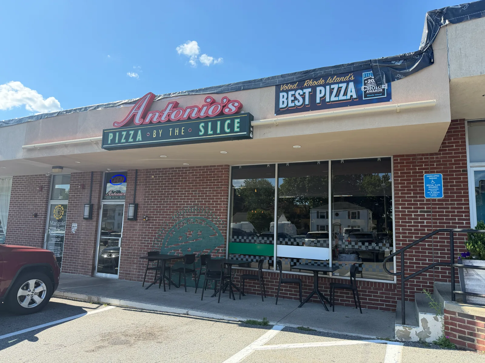 Antonio's Pizza Pawtucket storefront by day with the Rhode Island's Best Pizza banner