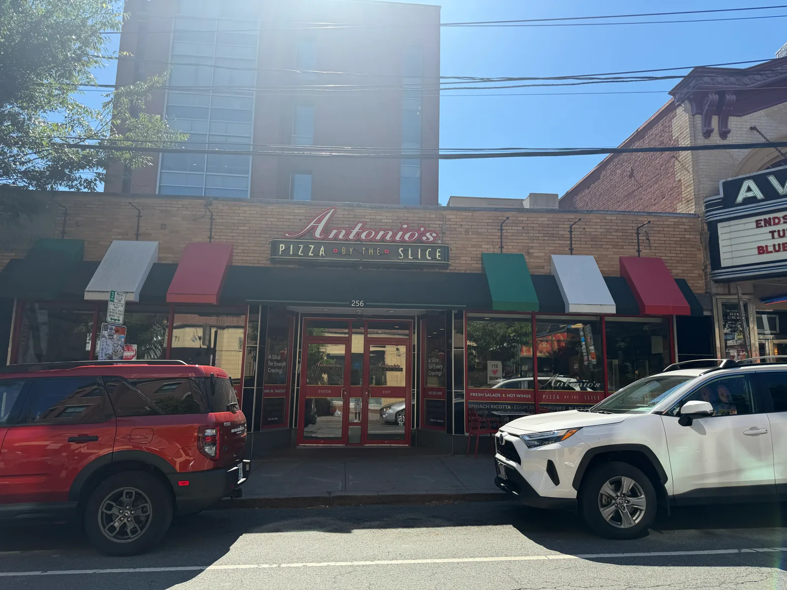 Antonio's Pizza Thayer Street storefront by day next to the Avon Cinema