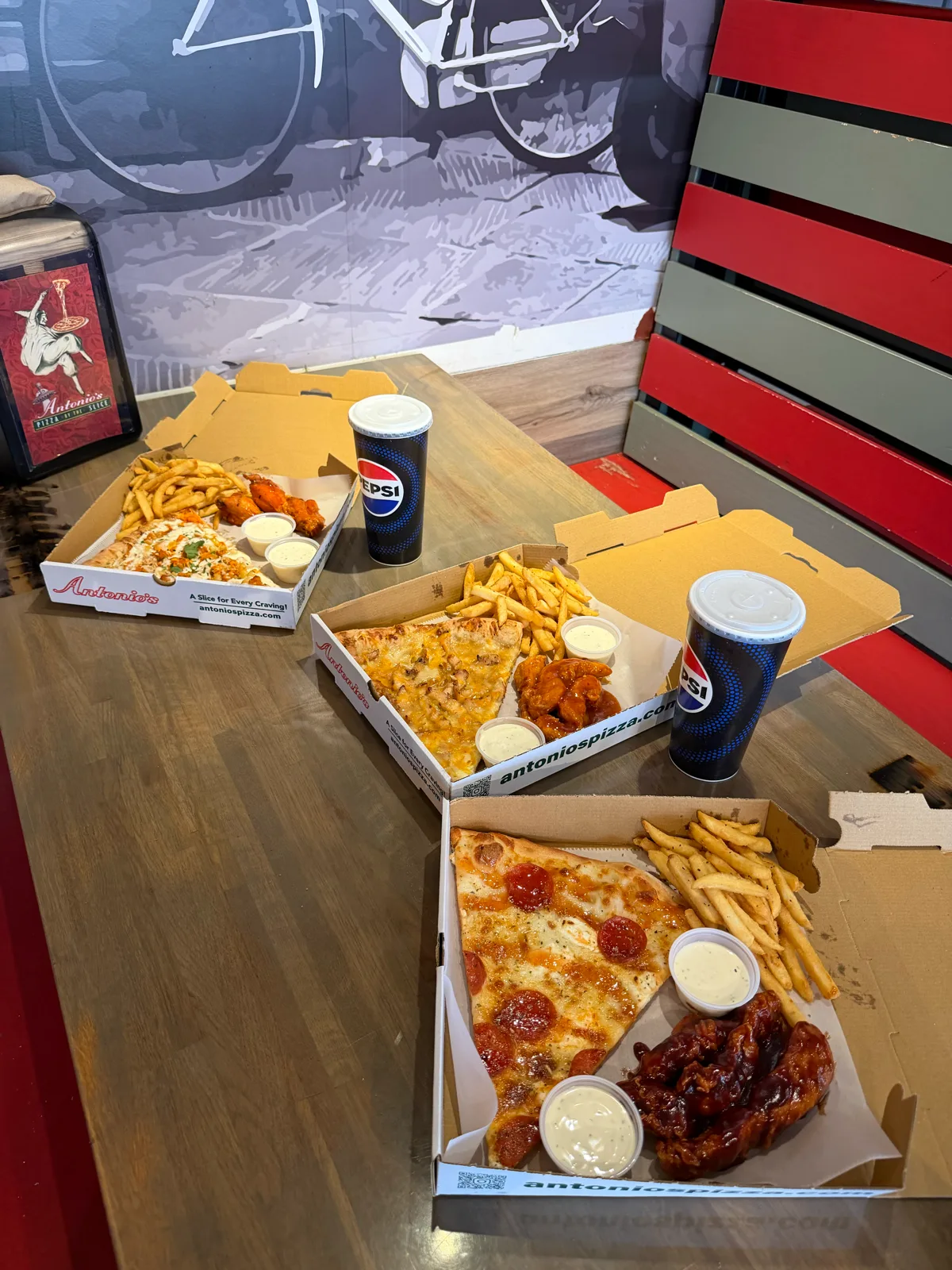 A spread of pizza, wings, nachos and fries at Antonio's Thayer Street