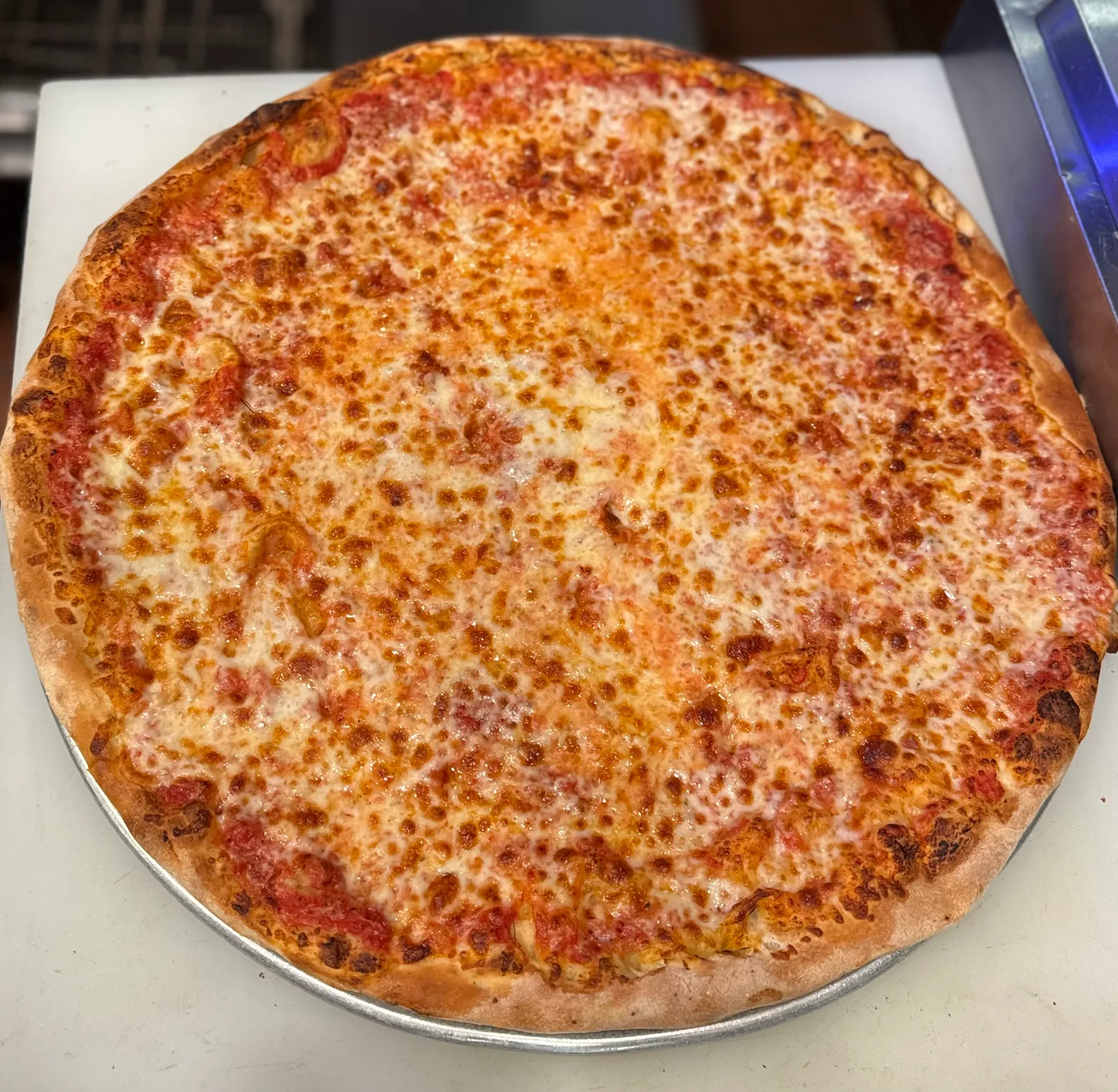Antonio's classic cheese pizza fresh out of the oven
