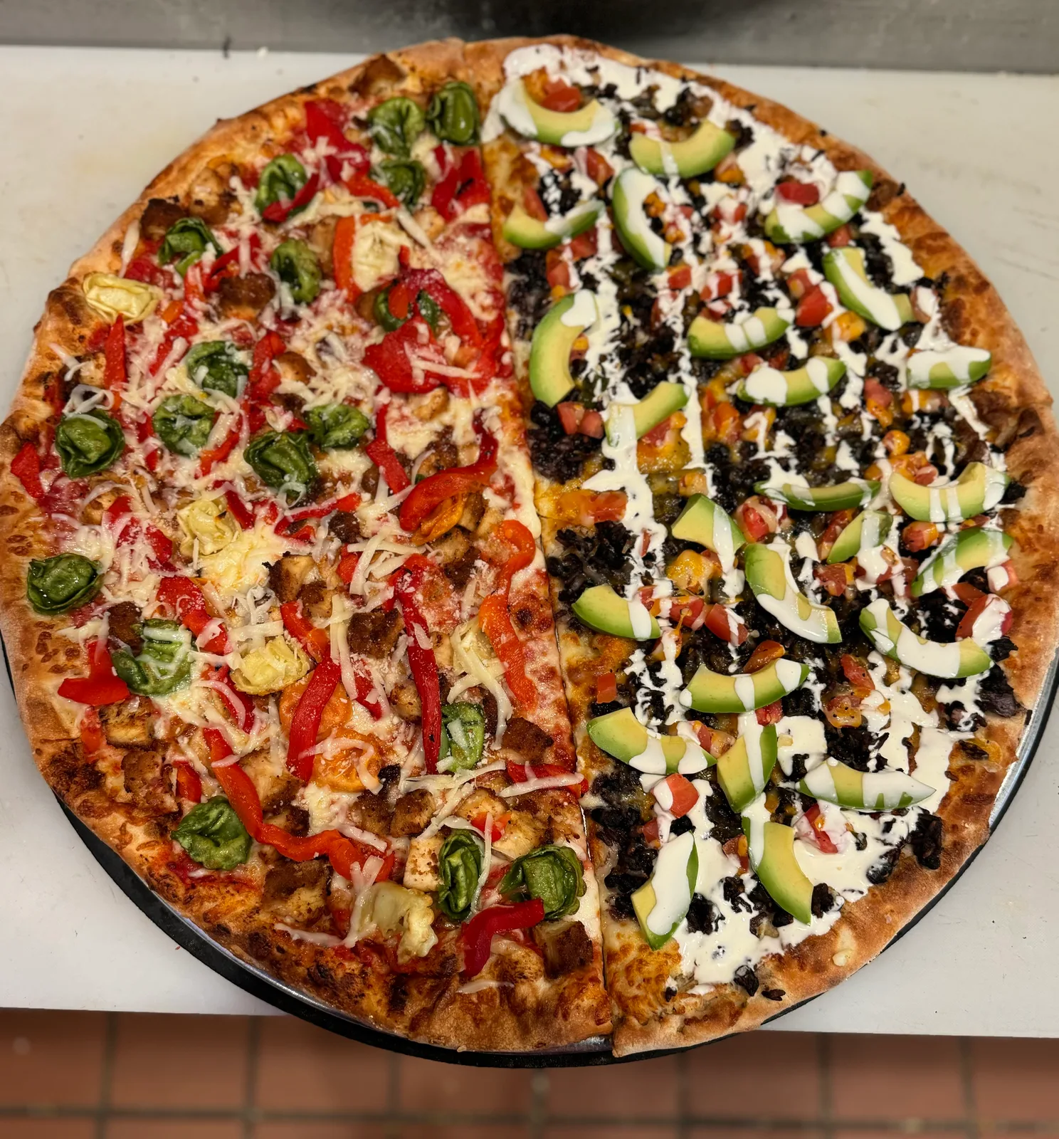 Antonio's half-and-half pie: roasted veggies on one side, avocado and black bean on the other